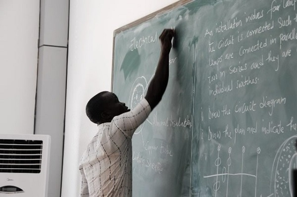 A Teacher teaching in the classroom