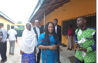 Charity Akua Foriwaa Dwommoh (middle) interacting with teachers of Menji Agric SHS