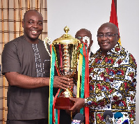 Vice President Dr. Mahamudu Bawumia and Sports Minister Isaac Asiamah displaying a trophy