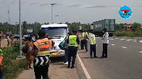 A photograph of police officials at an accident scene