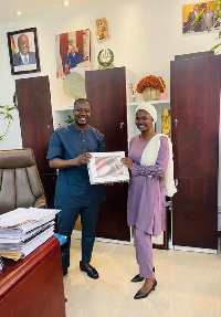 Deputy Chief of Staff, Alhaji Fawaz Aliu presenting the 14” MacBook Pro to Dr Mumuni Napari Hanifa