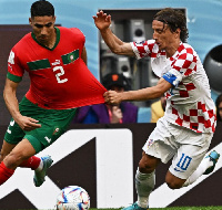 Morocco's Hakimi in a tussle with Luka Modric