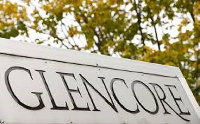 The logo of commodities trader Glencore is pictured in front of the company's headquarters in Baar,