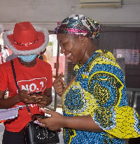 A beneficiary signing onto Vodafone