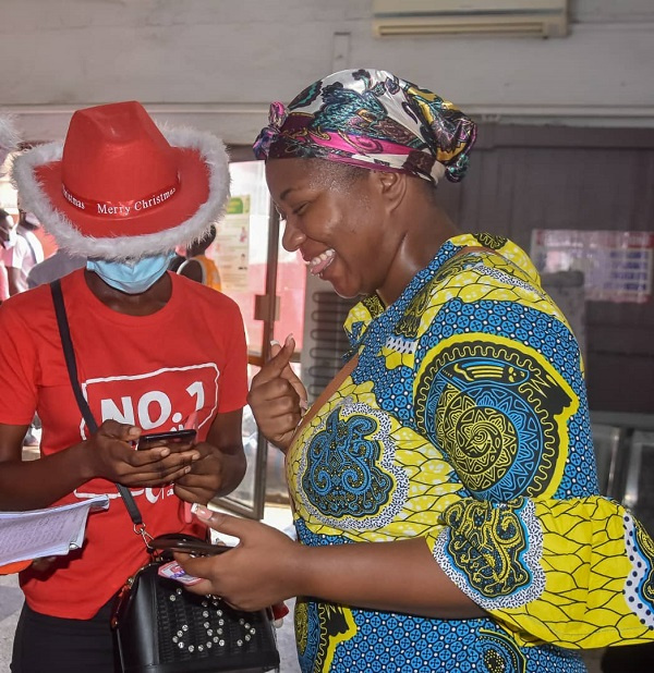 A beneficiary signing onto Vodafone