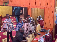 Members of Parliament engaged in a conversation