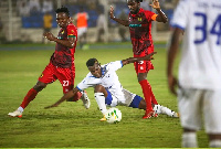 Kotoko players try to dispossess an opponent during the game