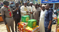 Alpha Radio officials making a presentation to Abdul Fatau Iddris.