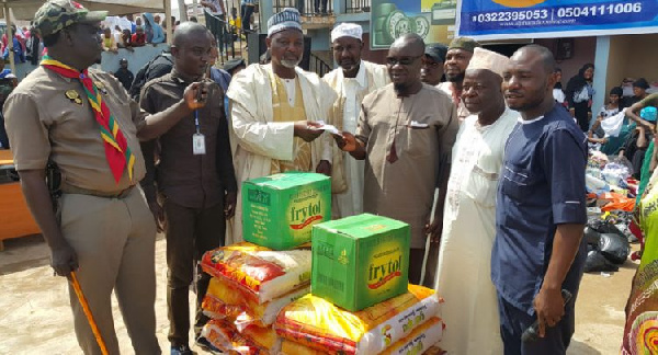 Alpha Radio officials making a presentation to Abdul Fatau Iddris.