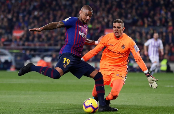 Barcelona's Kevin-Prince Boateng duels for the ball with Real Valladolid's Jordi Masip