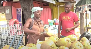 Helena Ogyam sells coconut water to help support her family