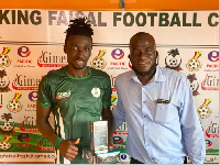 King Faisal defender Pius Baffour(L)