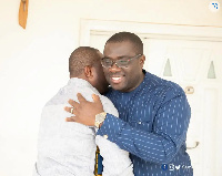 Director-General of the NLA, Sammi Awuku hugs Salam Mustapha