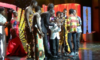 Abraham Attah with his plaque on stage