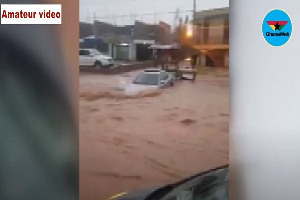 One of the cars partially submerge in the water