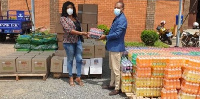 Mr. Bethel Yeboah, PAC Manager of TCCBCGL, handing over items to a representative