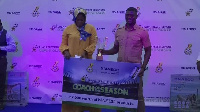 Coach Boadu (right) receiving his trophy at the awards event