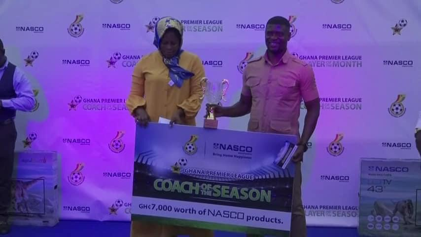 Coach Boadu (right) receiving his trophy at the awards event