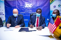 Joseph Siaw Agyepong and Mark Boswell signing the Memorandum of Understanding (MoU)