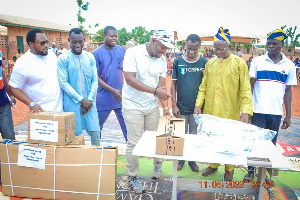 Alhassan Suhuyini and some of the beneficiaries