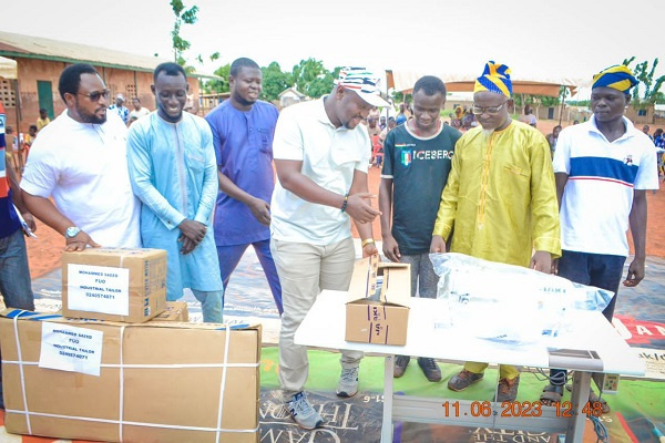 Alhassan Suhuyini and some of the beneficiaries