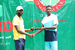Tennis enthusiasts Amoako Boafo doing presentation to winner Yakubu Abubakari