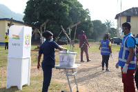 A Policewoman casting her vote