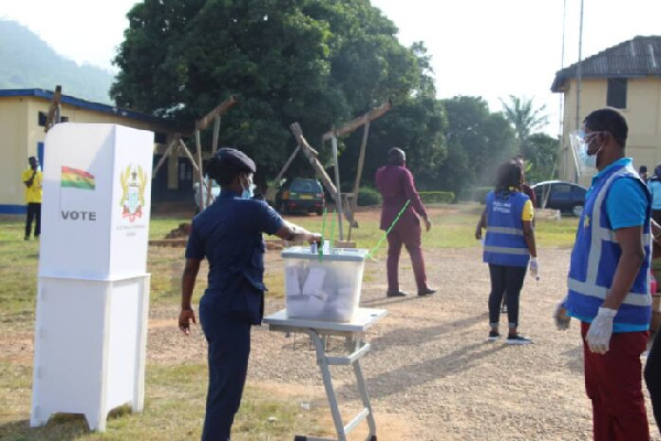 A Policewoman casting her vote