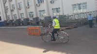 Ras Mubarak, MP for Kumbugu riding his bike to parliament