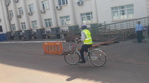 Ras Mubarak, MP for Kumbugu riding his bike to parliament