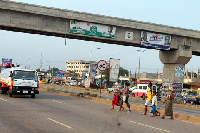 Pedestrians dangerously crossing from one of the abandoned footbridges