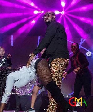 Sista Afia twerking on Gasmilla on stage at the Ghana Music Awards UK