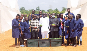 A delegtaion at the Youth in Greenhouse Enterprise Project (YuGEP) production site at Kyebi