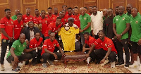 The management, technical team, and players of Asante Kotoko with former president, Kufuor