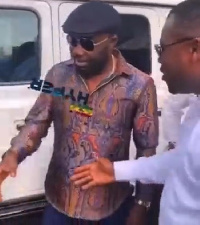 Osei Kwame Despite skips Abeiku Santana's handout for a handshake