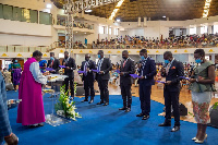 Sam George (sixth from right) being ordained alongside others