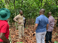 Cocobod CEO Joseph Boahen Aidoo with his officials on a tour