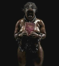 Naked woman holding a Bible