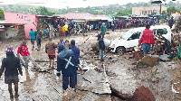 People line a muddy road in this image tweeted by Malawi Red Cross Society on March 13