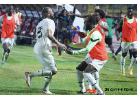 Jordan Ayew celebrates with teammates after scoring against CAR