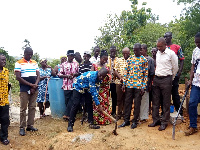 Simon Kweku Tetteh cutting sod for the construction of Wawase healthcare