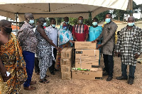 The MP (fourth right) making a donation after a Community Outreach town hall meeting