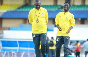 Kwesi Appiah,  coach of the Black Stars with Enugu Rangers goalkeeper Nana Bonsu