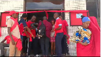 In protest and to express their discontent, the workers have taken to wearing red clothing