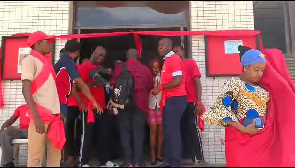 In protest and to express their discontent, the workers have taken to wearing red clothing