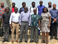 Members of the committee in a group photo with the journalists