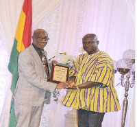 Medeama President, Moses Armah (in a smock) receiving his award