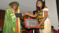 Dr Fathia Kareem receiving an award at her graduation