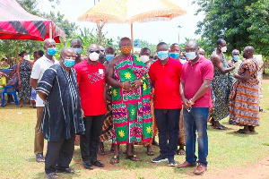 Nana Baffour O. Bediako has (middle)  has commended Vodafone Ghana Foundation for its help