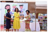 Angela Okai handing over some books